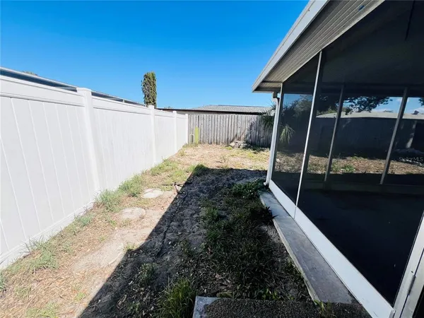 a view of a backyard of the house