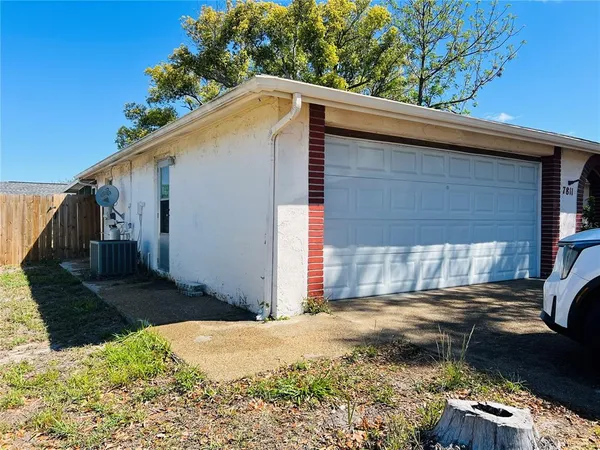 a kitchen with stainless steel appliances a refrigerator sink and microwave