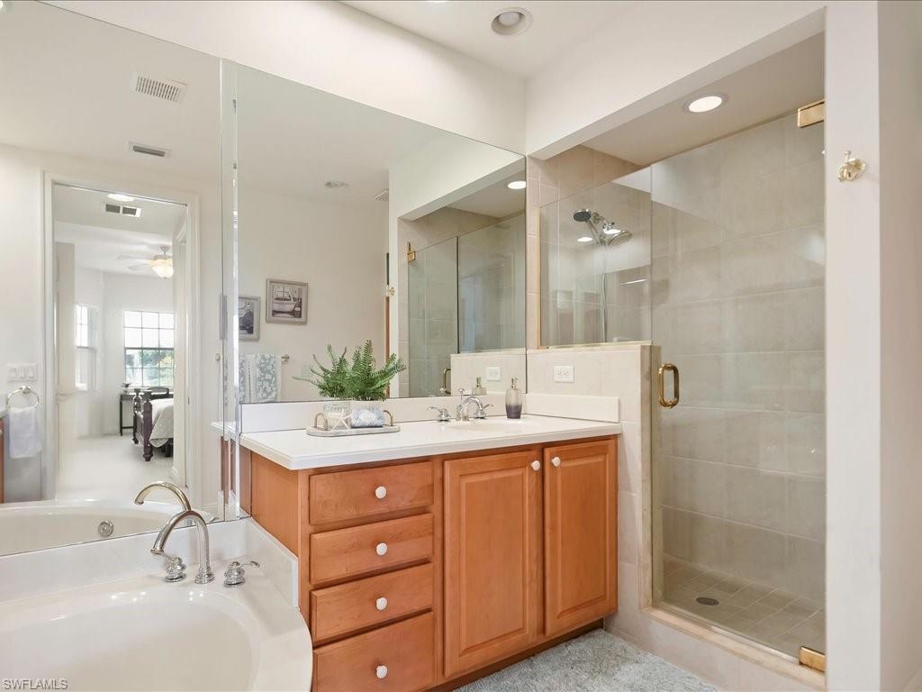 7832 Hawthorne Drive, Unit 1902 Naples, FL 34113 - Photo 19 of 43 a bathroom with a sink double vanity and shower