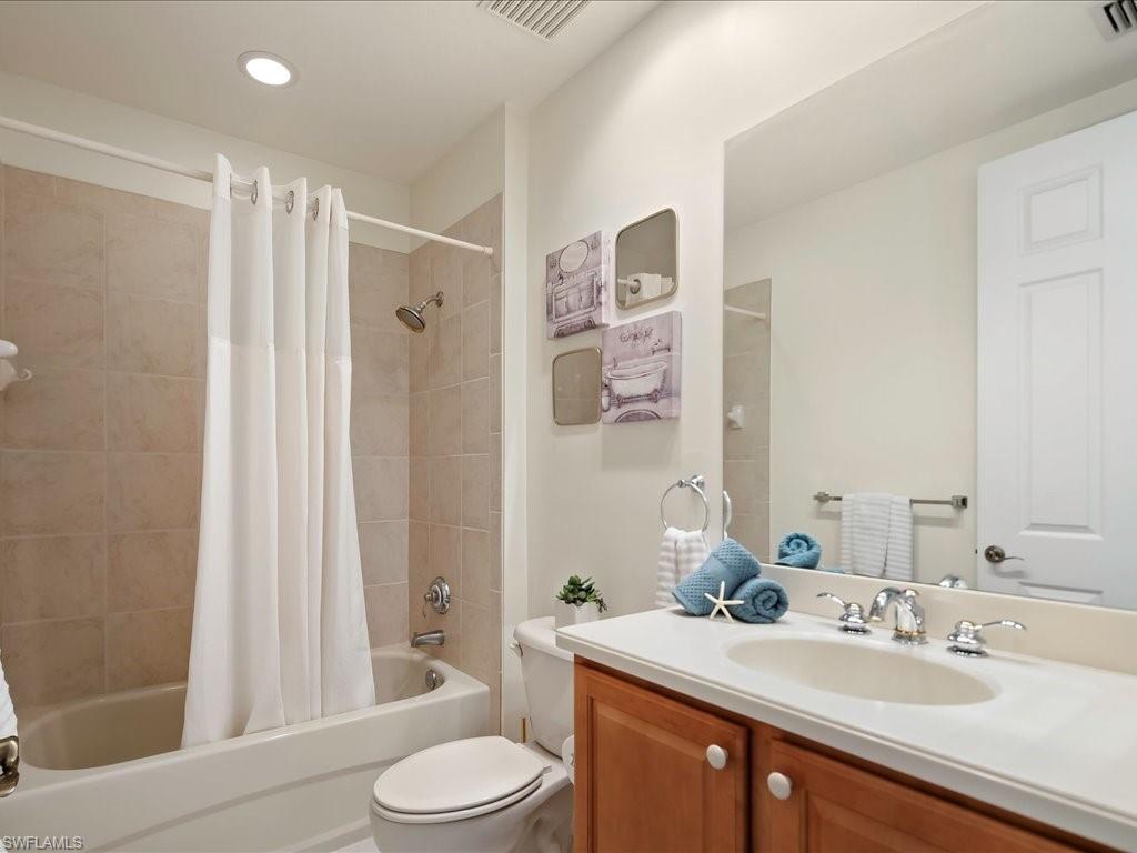 7832 Hawthorne Drive, Unit 1902 Naples, FL 34113 - Photo 23 of 43 a bathroom with a sink toilet and shower