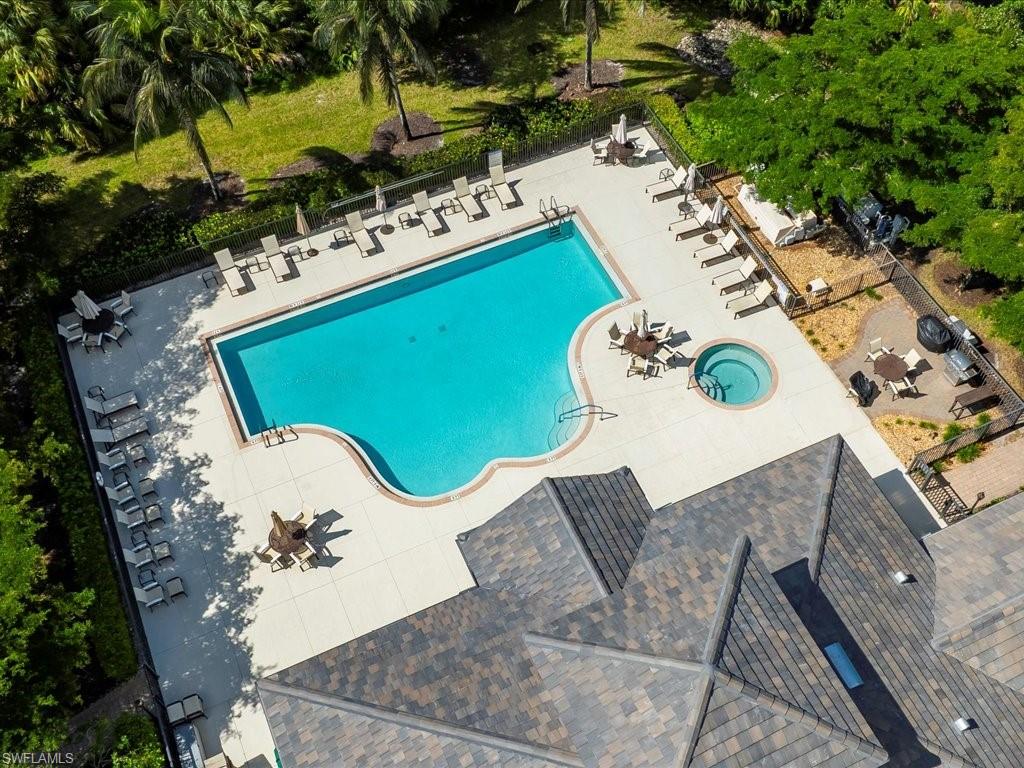 7832 Hawthorne Drive, Unit 1902 Naples, FL 34113 - Photo 30 of 43 an aerial view of a house with a swimming pool