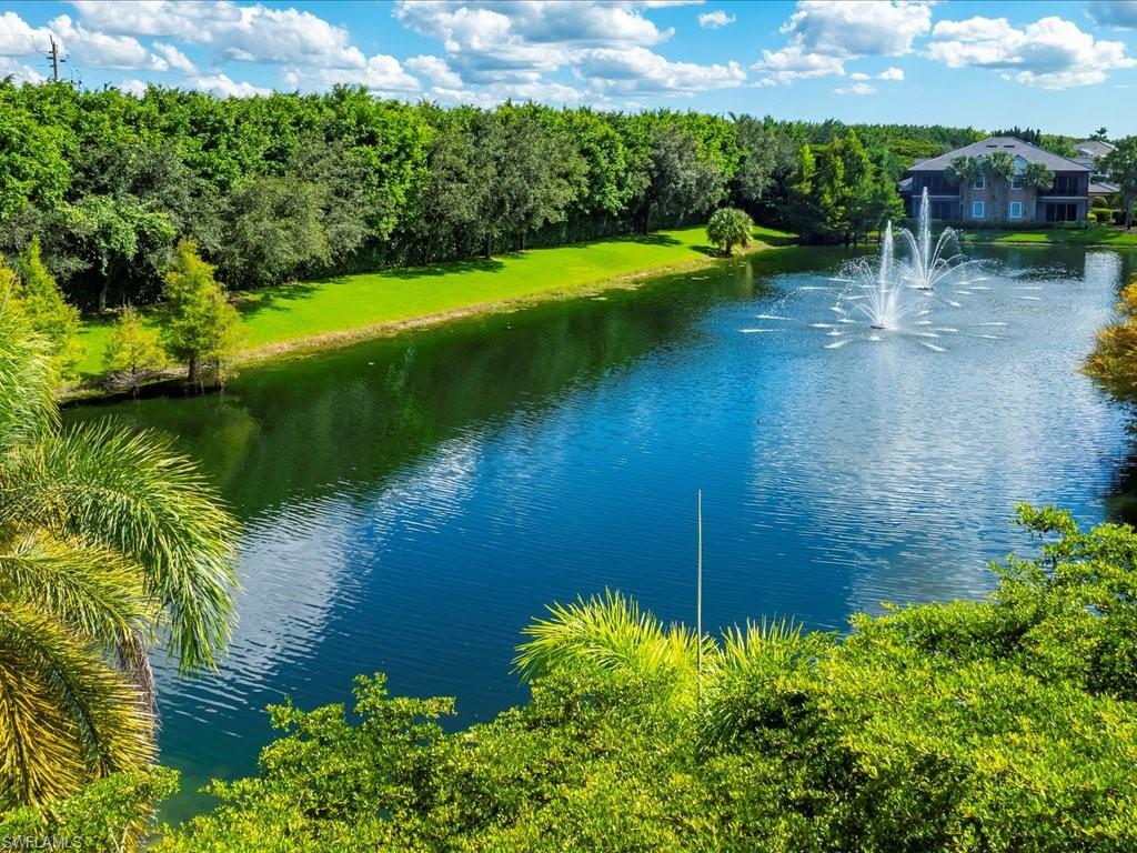 7832 Hawthorne Drive, Unit 1902 Naples, FL 34113 - Photo 31 of 43 a view of a lake with a garden
