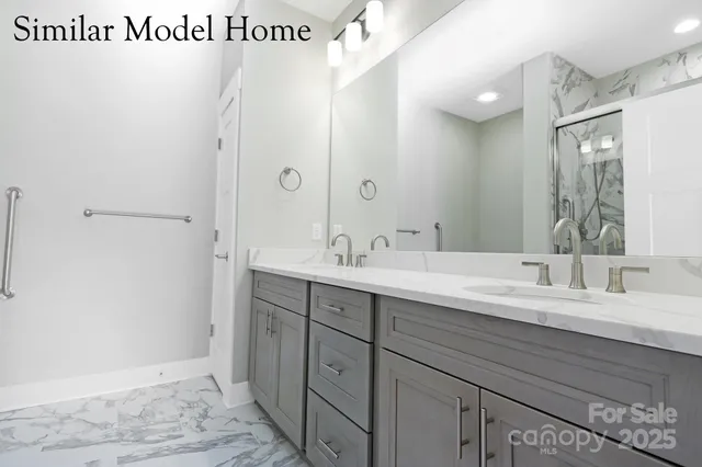 a bathroom with a sink a mirror and a shower