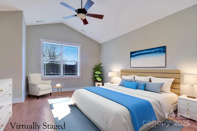 a bedroom with a large bed and a couch