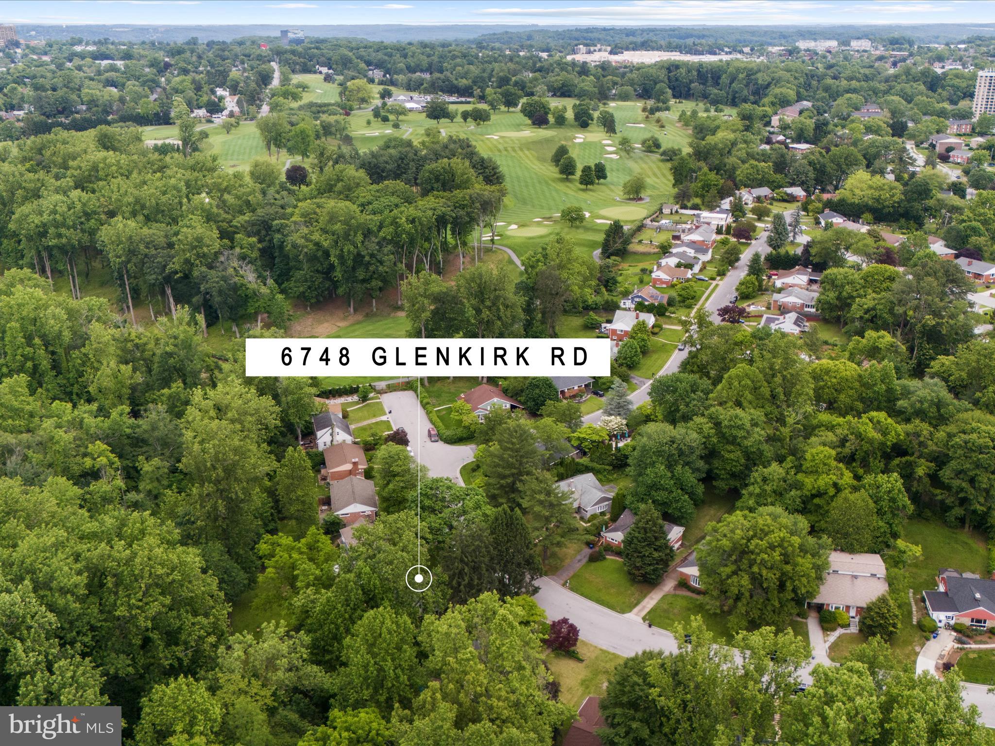 6748 Glenkirk Road Baltimore, MD 21239 - Photo 54 of 61 an aerial view of residential house with outdoor space and trees all around