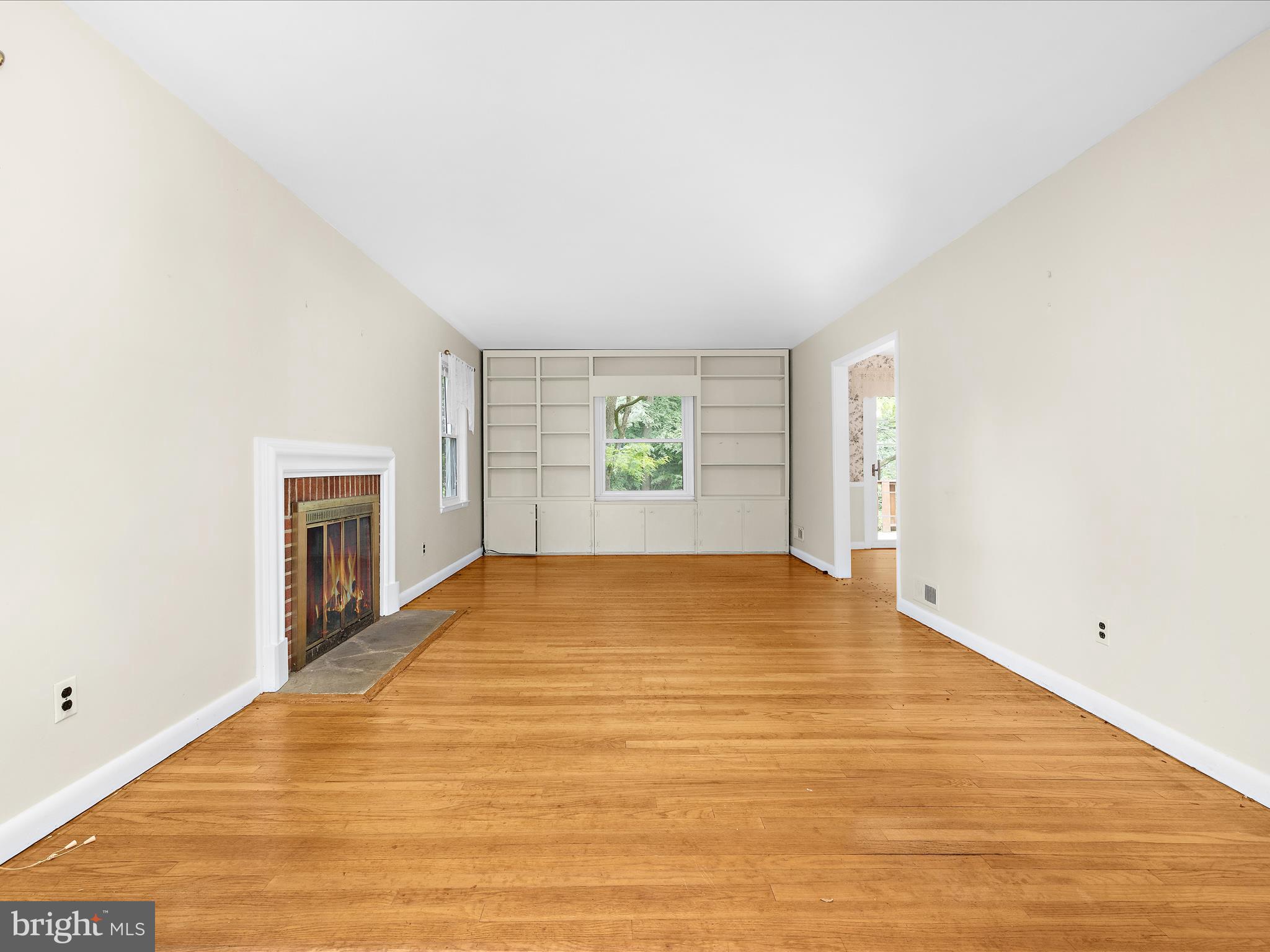 6748 Glenkirk Road Baltimore, MD 21239 - Photo 8 of 61 a view of empty room with a fireplace