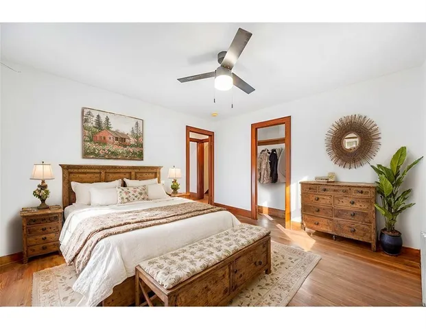 a bedroom with a bed and dresser