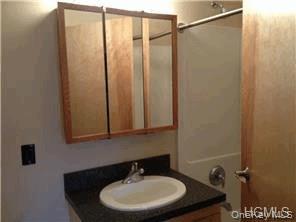 20 South Broadway, Unit 304 Nyack, NY 10960 - Photo 2 of 11 a bathroom with a sink and a mirror