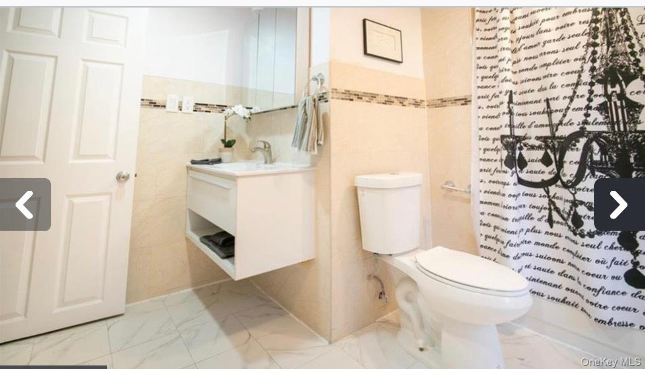 57 Menges Road Youngsville, NY 12791 - Photo 12 of 22 a white toilet sitting next to a bathroom sink