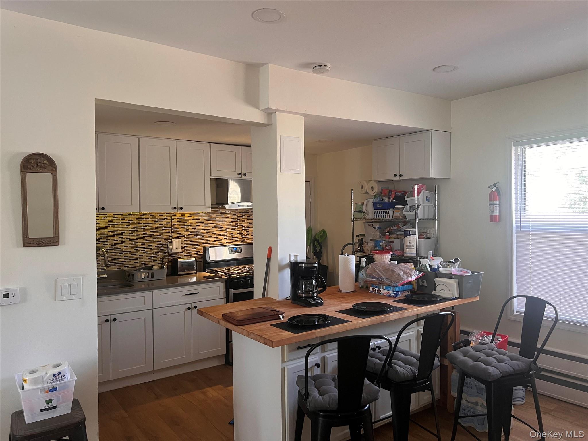 57 Menges Road Youngsville, NY 12791 - Photo 4 of 22 a kitchen with a table and chairs in it