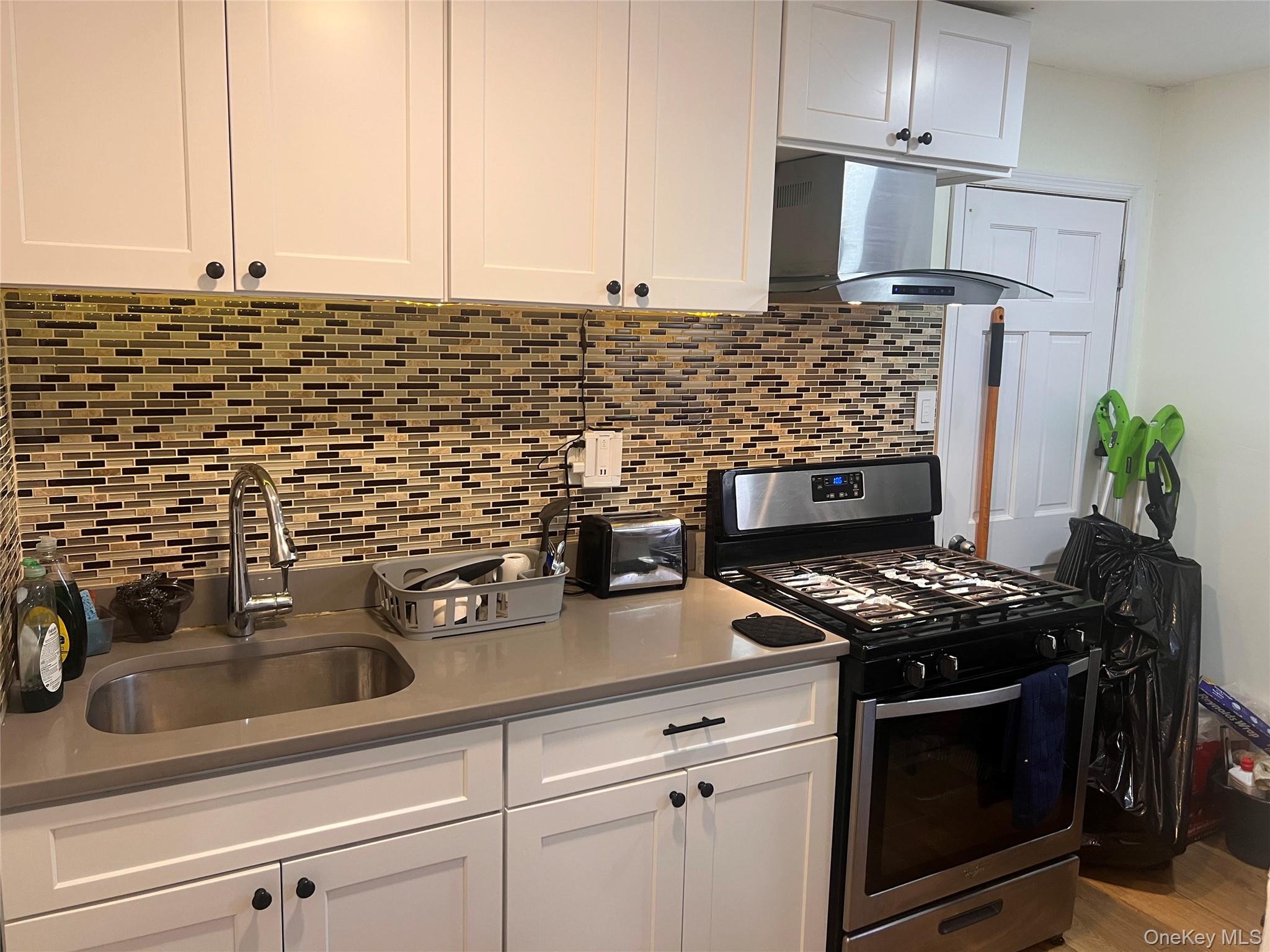 57 Menges Road Youngsville, NY 12791 - Photo 5 of 22 a kitchen with stainless steel appliances a stove and a sink