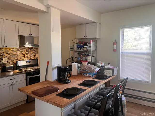 a kitchen with a stove and a refrigerator
