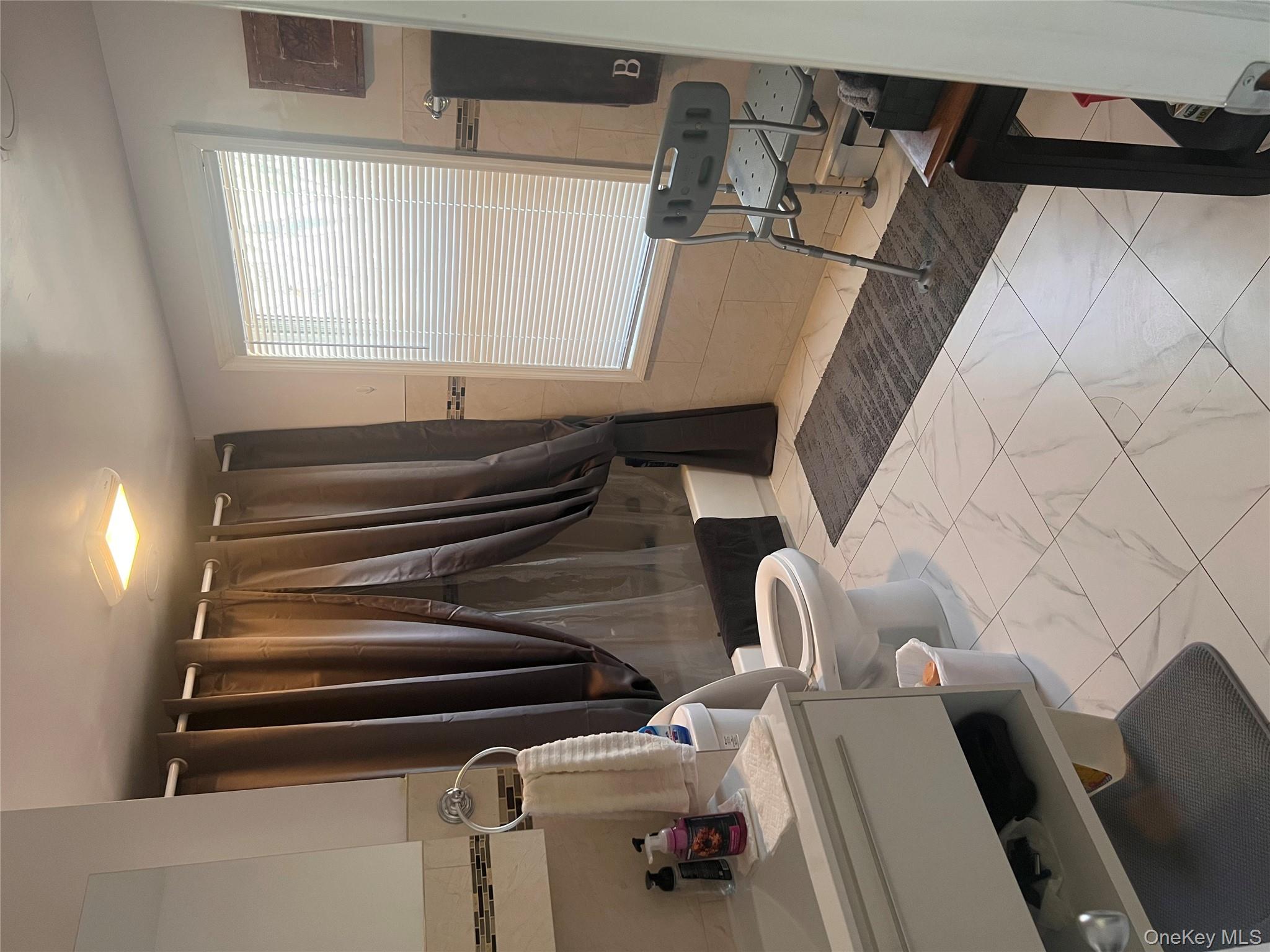 57 Menges Road Youngsville, NY 12791 - Photo 10 of 22 a bathroom with a sink a toilet a tub and shower