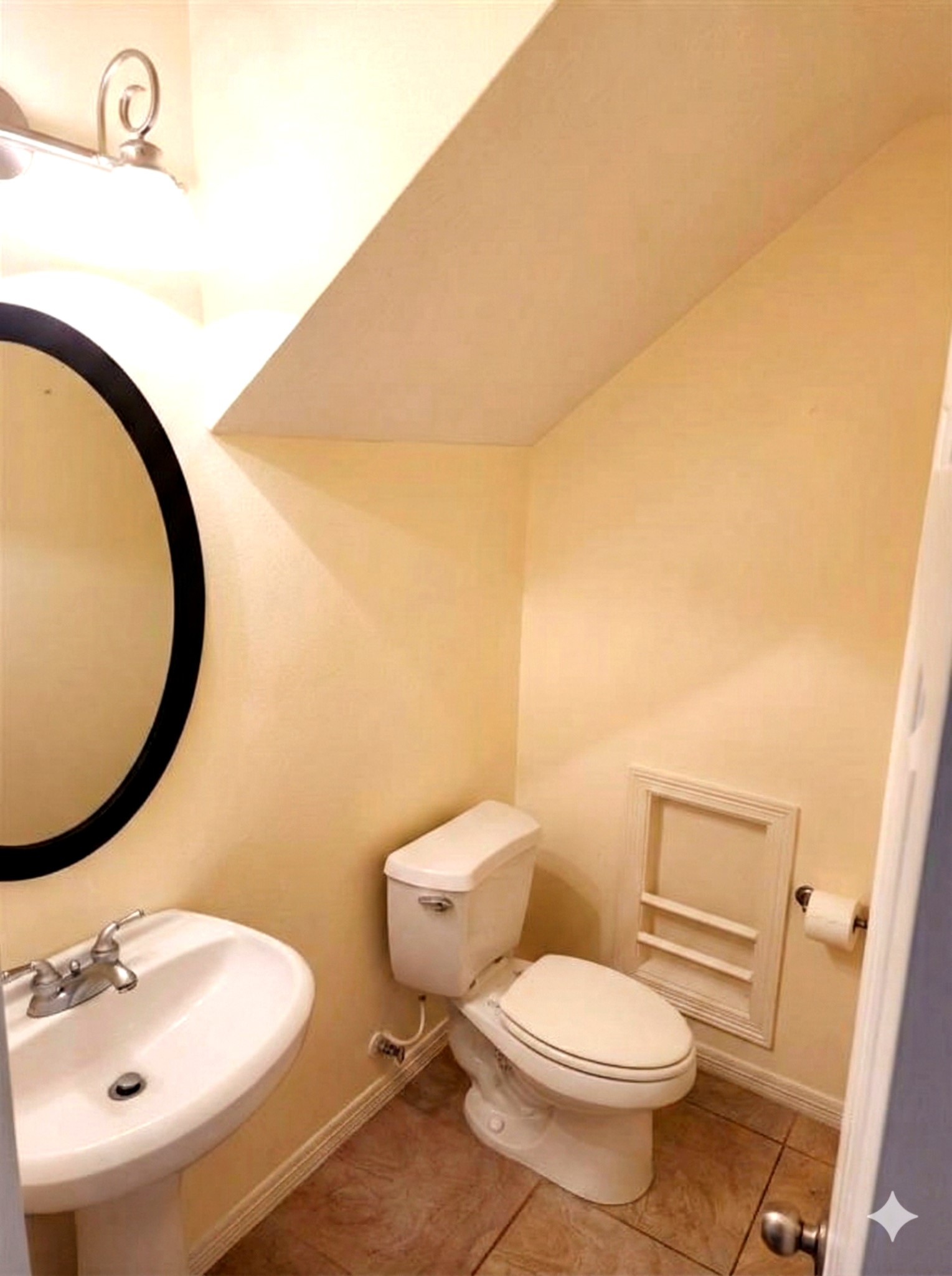 1622 Cohn Street Houston, TX 77007 - Photo 13 of 26 a white toilet sitting next to a bathroom sink