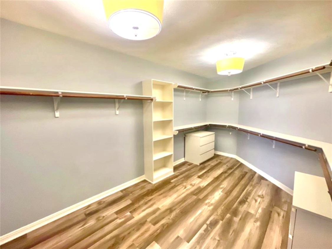 1622 Cohn Street Houston, TX 77007 - Photo 24 of 26 a view of a room with cabinet and a wooden floor