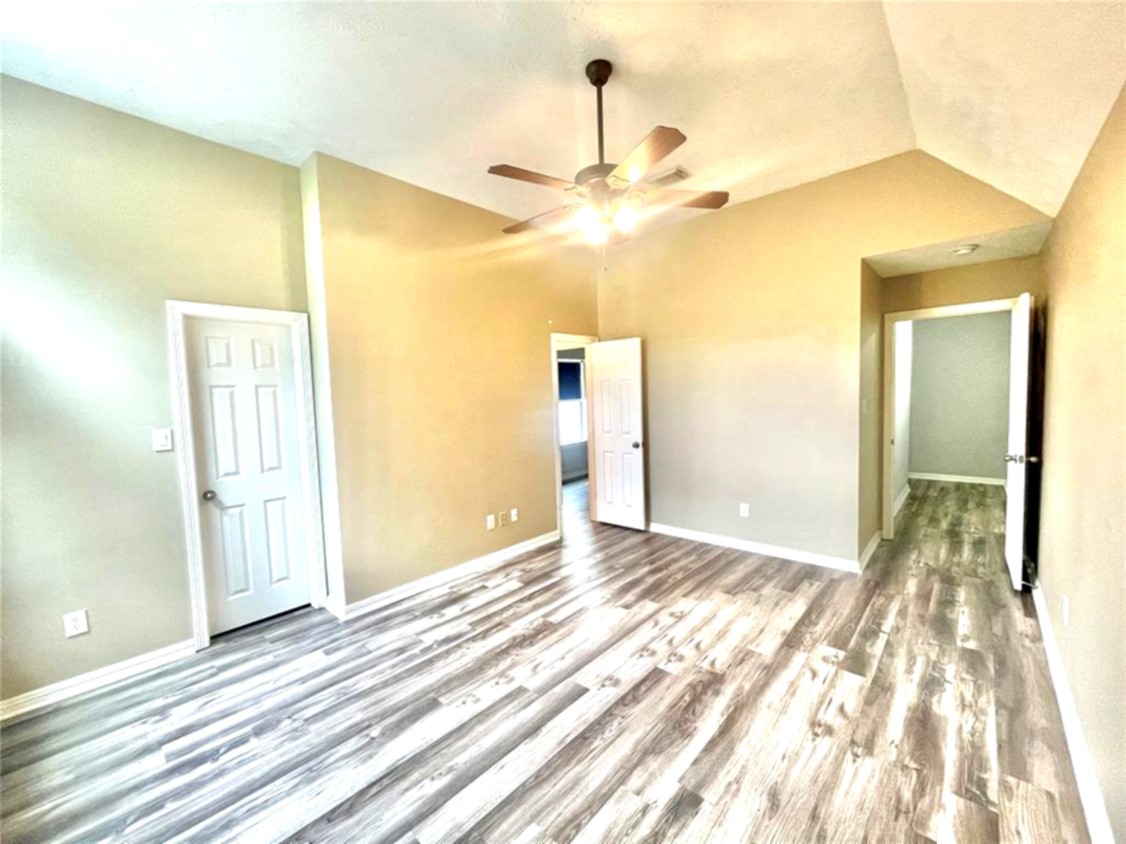1622 Cohn Street Houston, TX 77007 - Photo 4 of 26 a view of a big room with wooden floor and chandelier fan