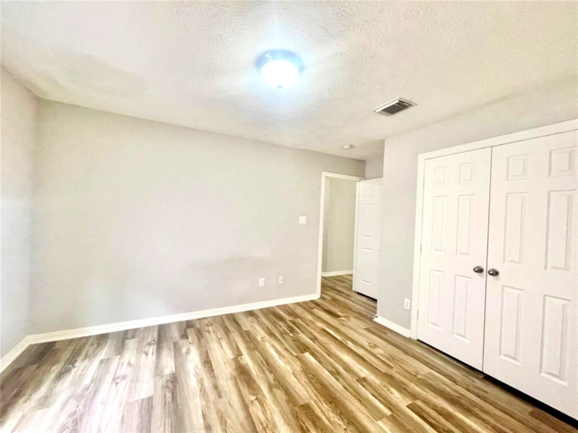 1622 Cohn Street Houston, TX 77007 - Photo 6 of 26 a view of a room with wooden floor and bathroom
