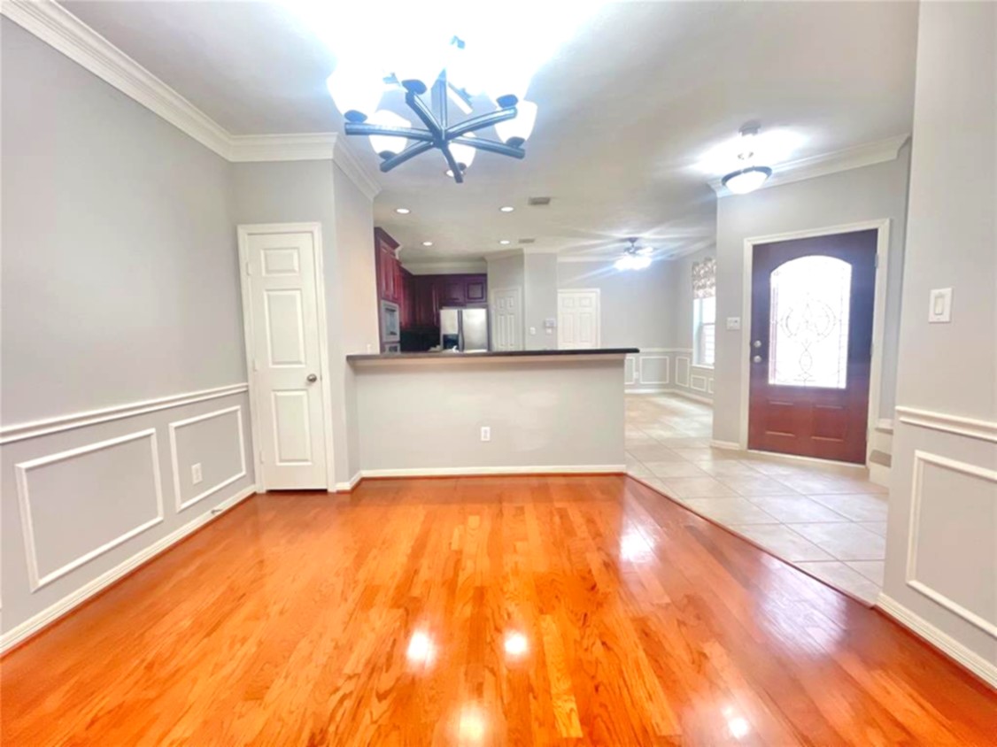 1622 Cohn Street Houston, TX 77007 - Photo 9 of 26 a view of a kitchen with a sink and a microwave