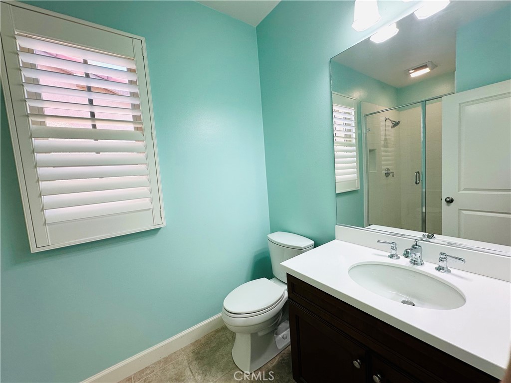 53 Triana Irvine, CA 92618 - Photo 33 of 42 a bathroom with a sink and a toilet