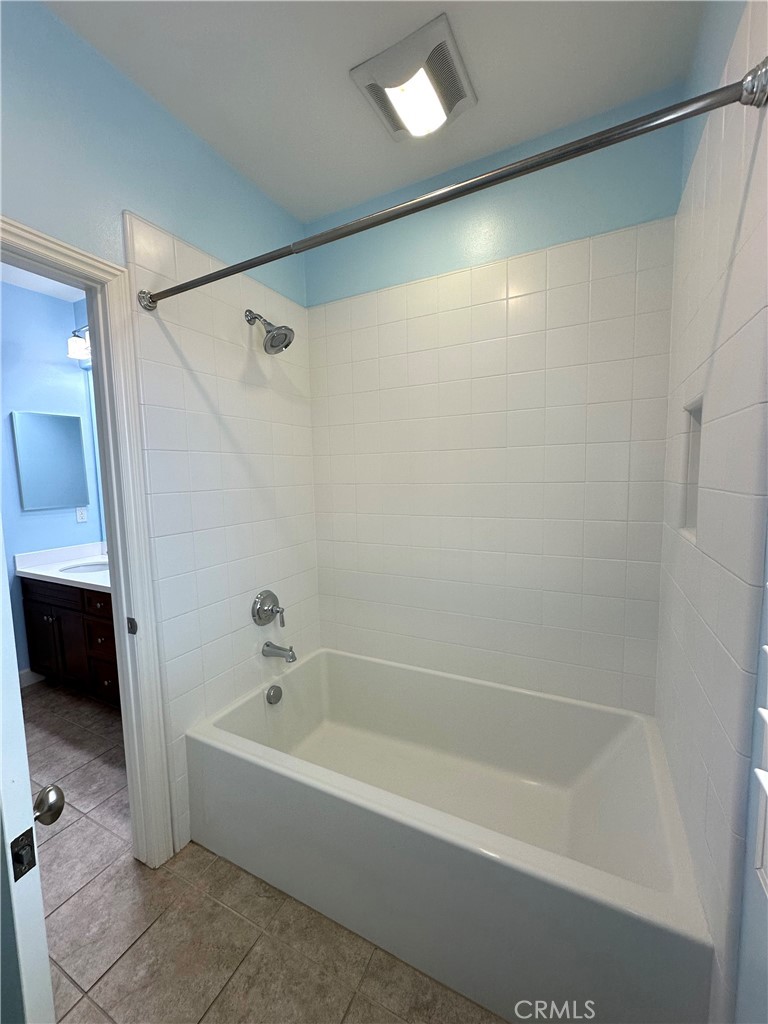 53 Triana Irvine, CA 92618 - Photo 36 of 42 a bathroom with a bathtub and a shower
