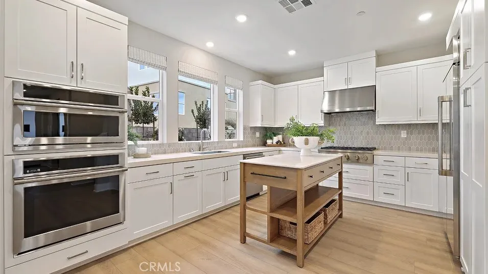 1711 Lychee Street Fullerton, CA 92835 - Photo 1 of 29 a kitchen with a sink stove and microwave