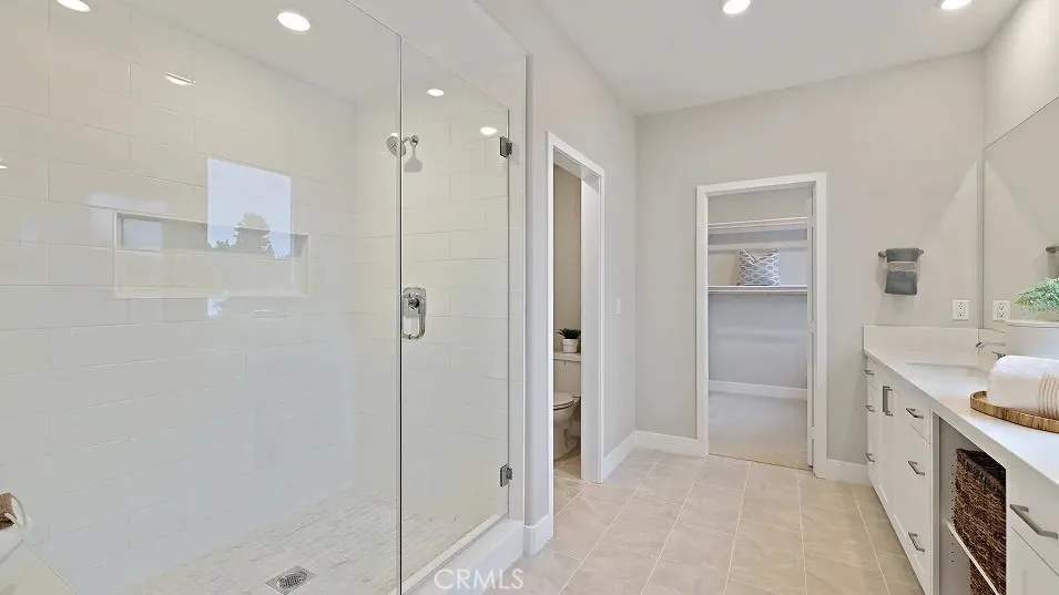 1711 Lychee Street Fullerton, CA 92835 - Photo 13 of 29 a bathroom with a tub shower vanity and sink