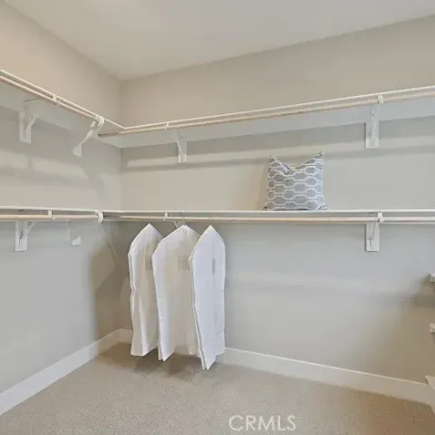 a bed room with a bed and a chandelier