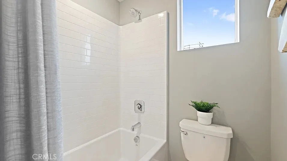 1711 Lychee Street Fullerton, CA 92835 - Photo 19 of 29 a bathroom with a toilet a sink and a bathtub