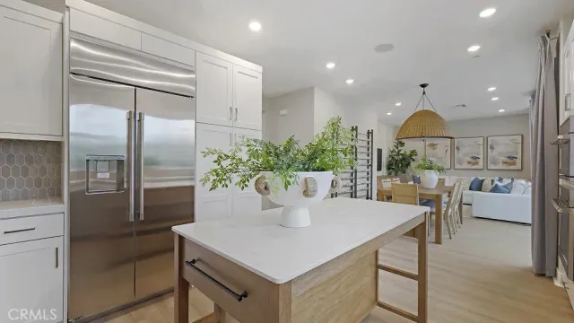 a kitchen with a table and chairs