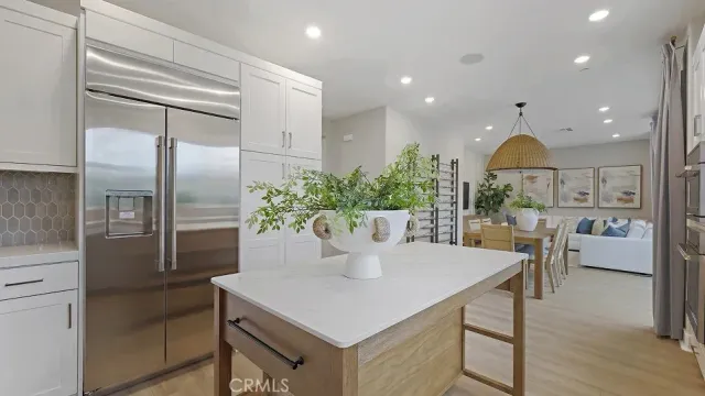 a kitchen with a table and chairs in it