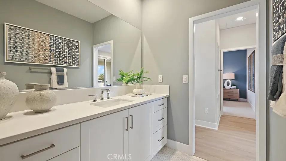 1711 Lychee Street Fullerton, CA 92835 - Photo 21 of 29 a en suite bathroom with a sink and a mirror