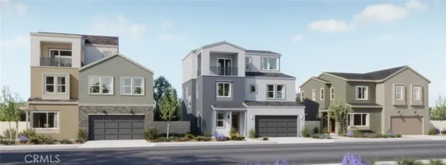 a house with lots of trees in front of it