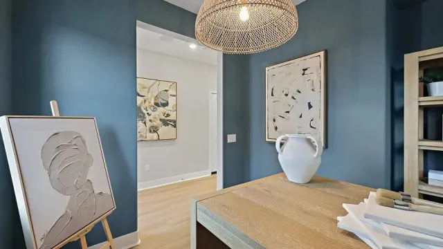 a bedroom with furniture and a large window