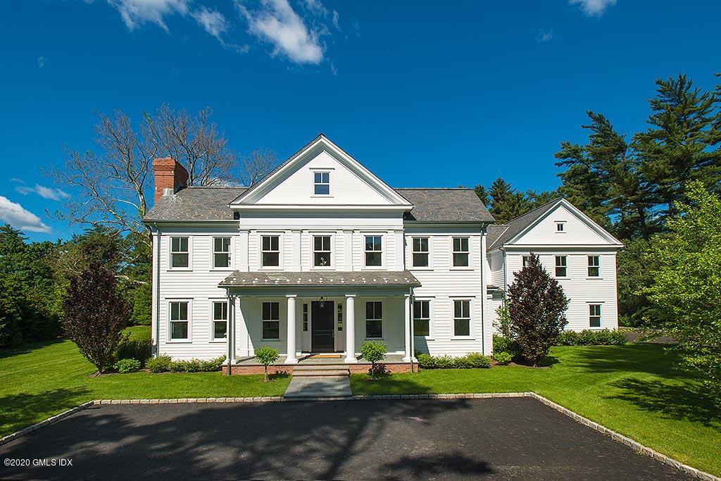 500 Lake Avenue Greenwich, CT 06830 - Photo 1 of 1 a front view of a house with a garden