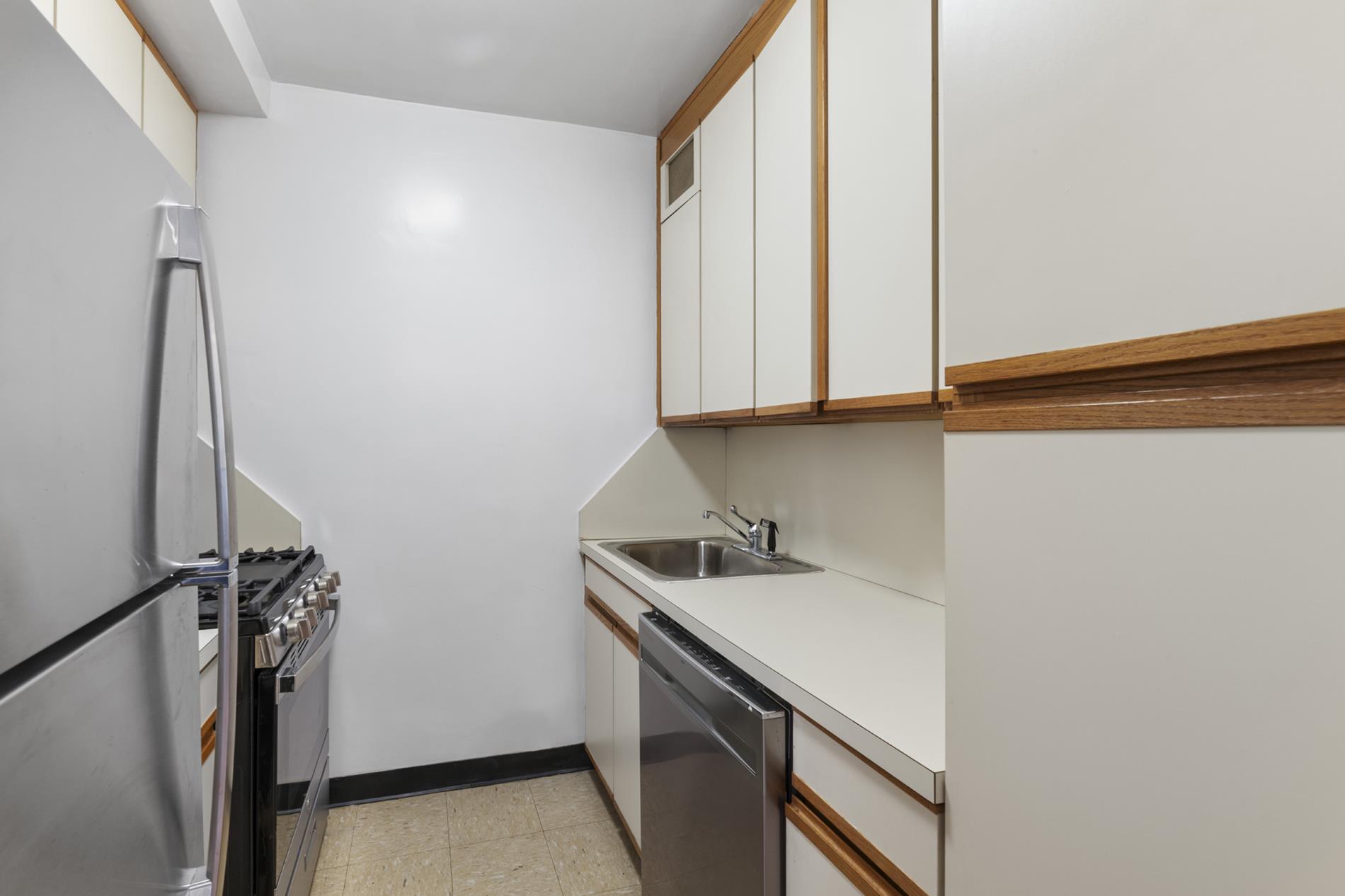30 West 60th Street, Unit 10S Manhattan, NY 10019 - Photo 6 of 15 a room with storage and utility