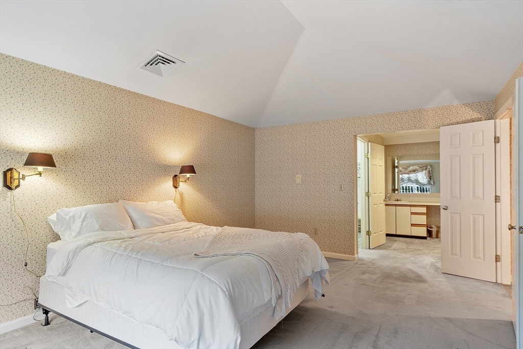 4004 Brompton Circle, Unit 4004 Worcester, MA 01609 - Photo 21 of 36 a bedroom with a bed and a table