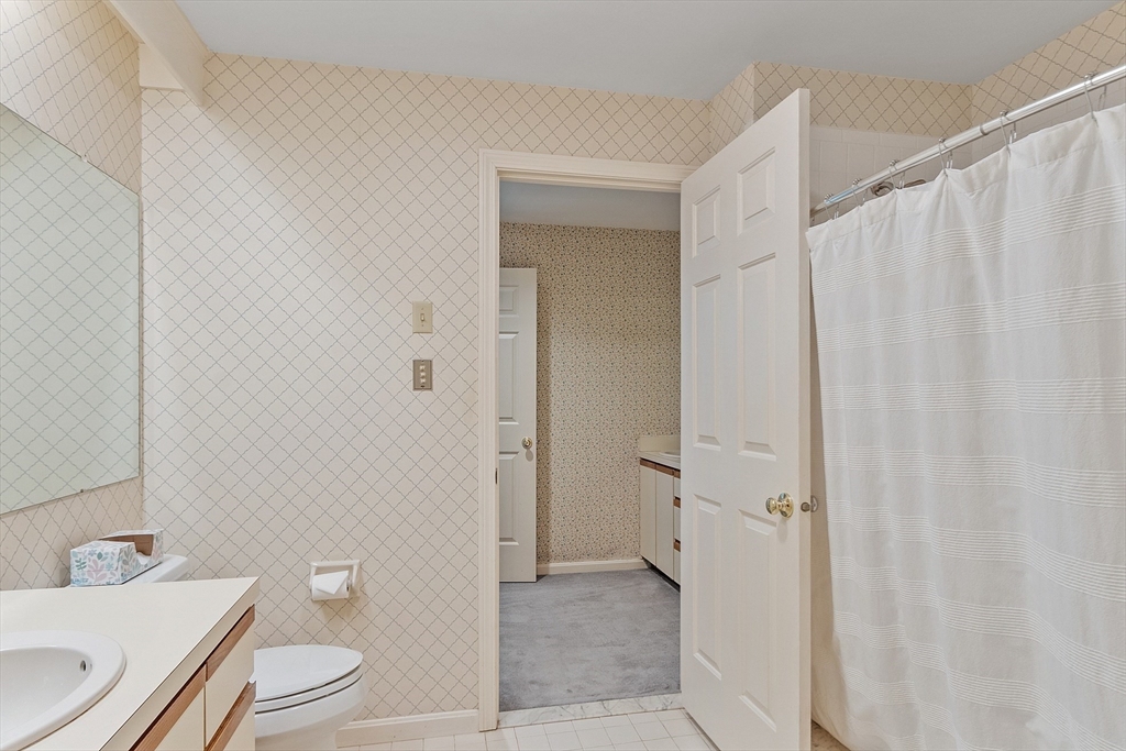 4004 Brompton Circle, Unit 4004 Worcester, MA 01609 - Photo 24 of 36 a bathroom with a toilet a sink and a shower