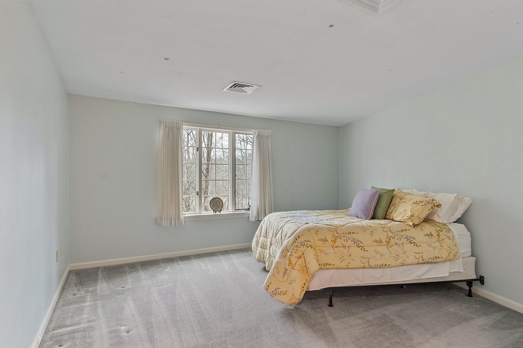 4004 Brompton Circle, Unit 4004 Worcester, MA 01609 - Photo 26 of 36 a bedroom with a bed and a window