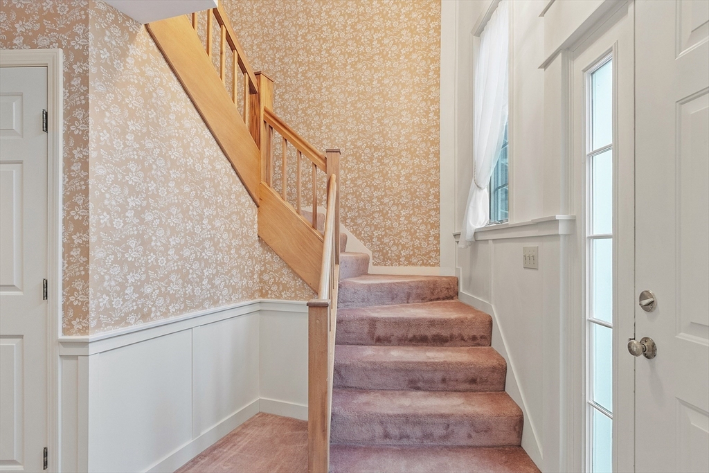 4004 Brompton Circle, Unit 4004 Worcester, MA 01609 - Photo 6 of 36 a view of staircase with wooden floor and white walls