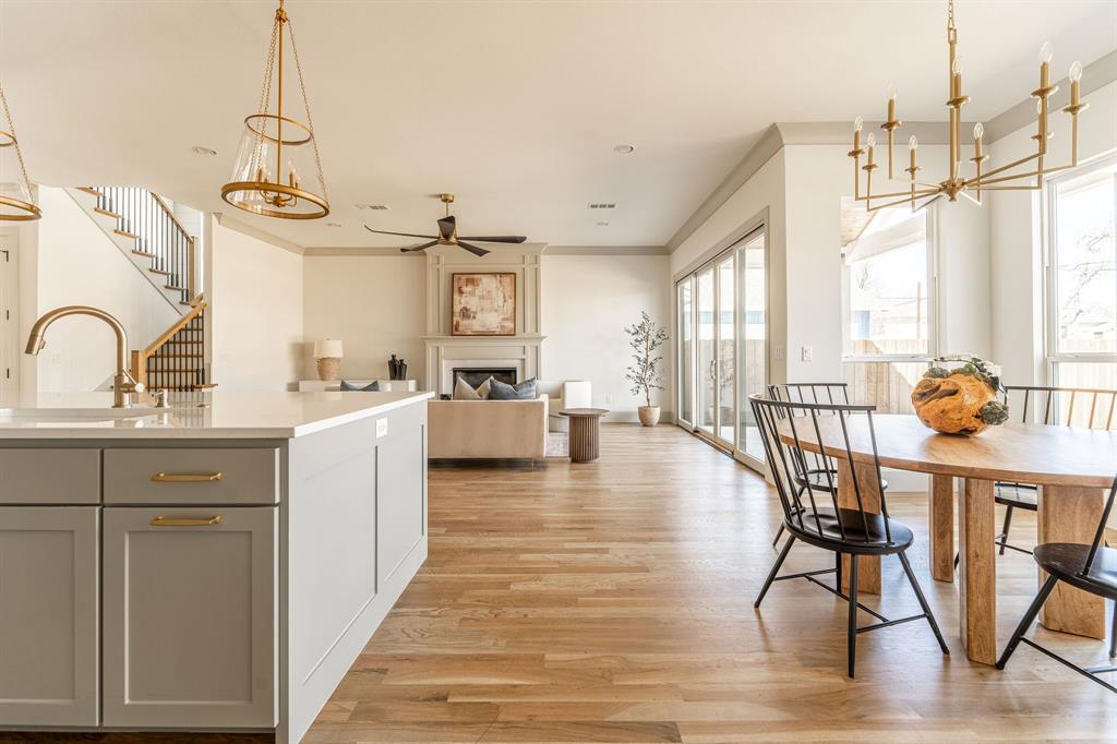 a view of a kitchen and dining room with wooden floor
