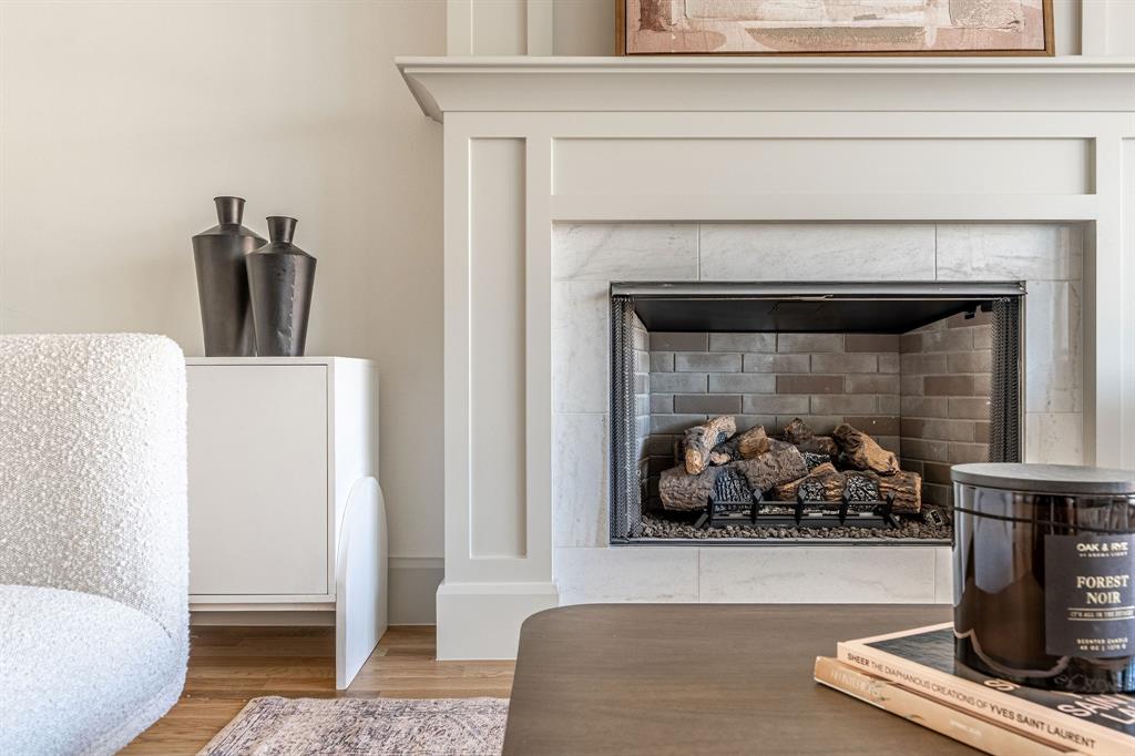 317 Travis Street Roanoke, TX 76262 - Photo 18 of 38 a living room with furniture and a fireplace