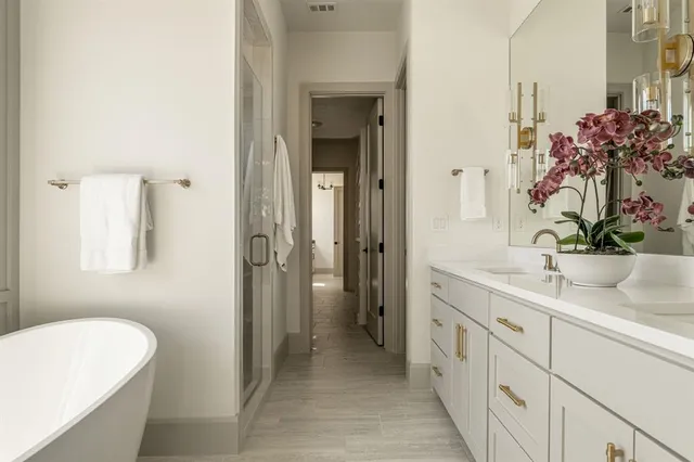 a kitchen with stainless steel appliances granite countertop a sink a stove and a refrigerator