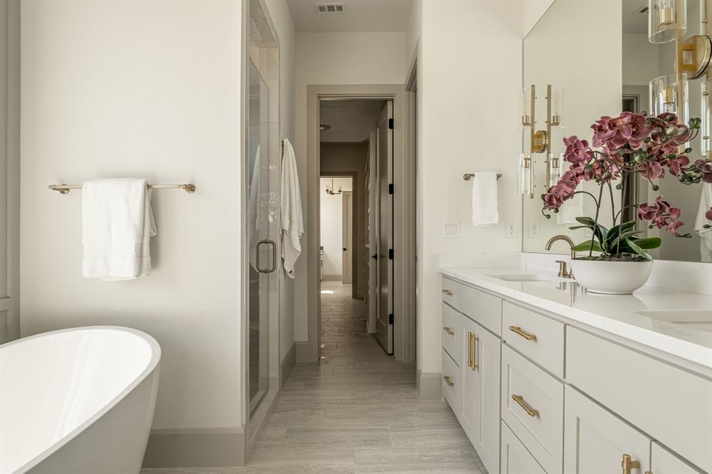 317 Travis Street Roanoke, TX 76262 - Photo 34 of 38 a bathroom with a sink a toilet and a mirror