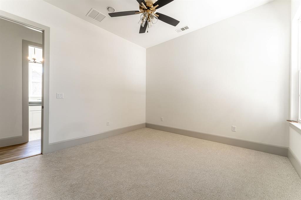 317 Travis Street Roanoke, TX 76262 - Photo 36 of 38 an empty room with a ceiling fan and window