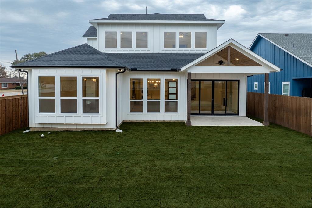 317 Travis Street Roanoke, TX 76262 - Photo 37 of 38 a front view of a house with a garden