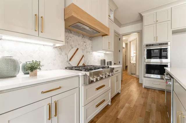 a kitchen with a stove and a sink