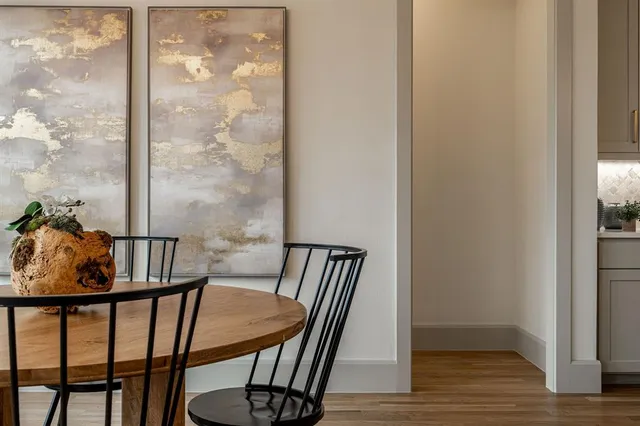a view of a balcony with furniture and wooden floor