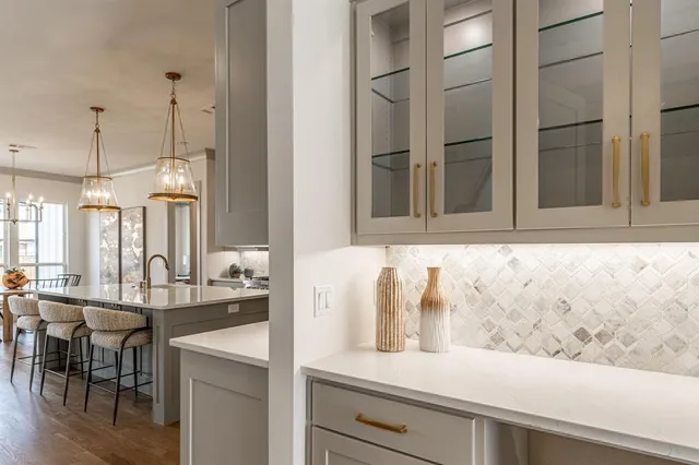 a view of a kitchen area with furniture and chandelier