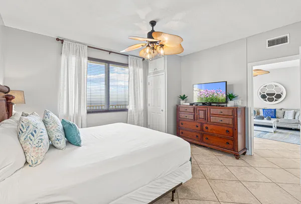 a bedroom with a bed and a television in it