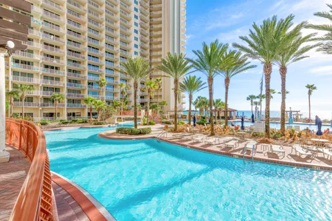 a view of swimming pool with outdoor seating